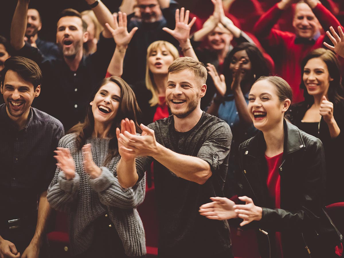 Audience applauding at the theatre