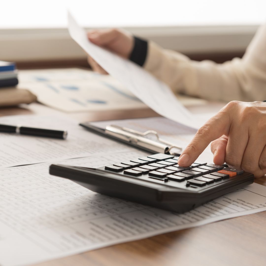 calculator and forms on desk